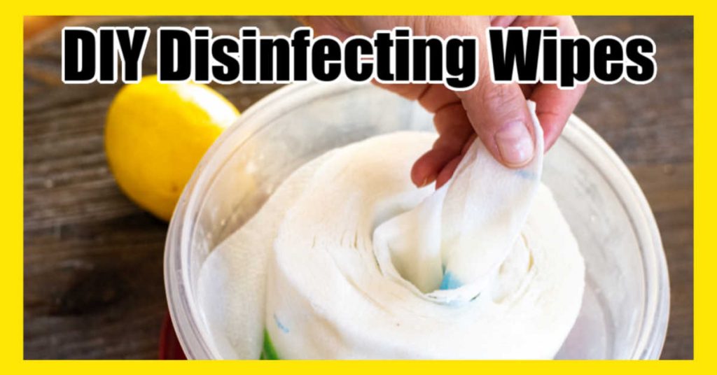 disposable disinfecting wipes being pulled from a plastic container