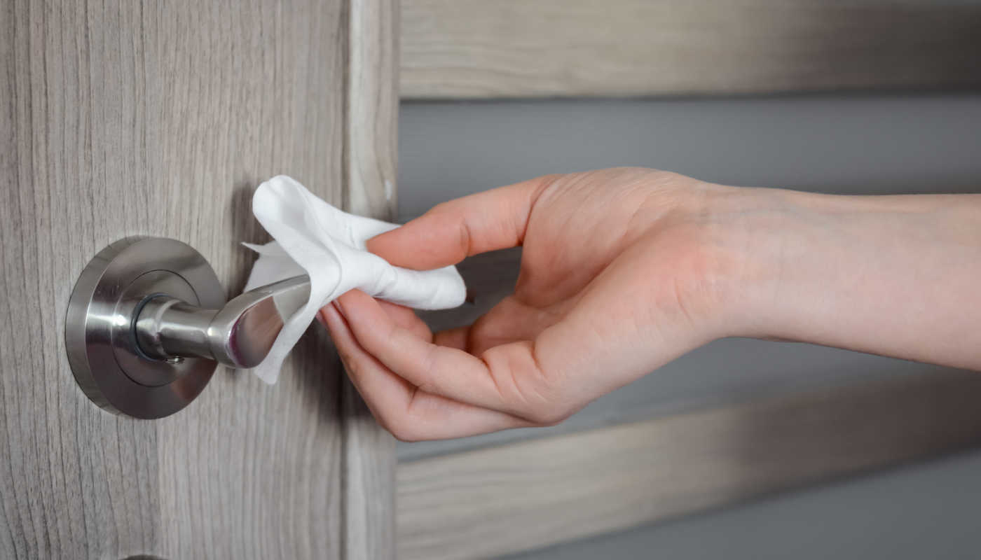 cleaning a door handle with the heavy duty spray